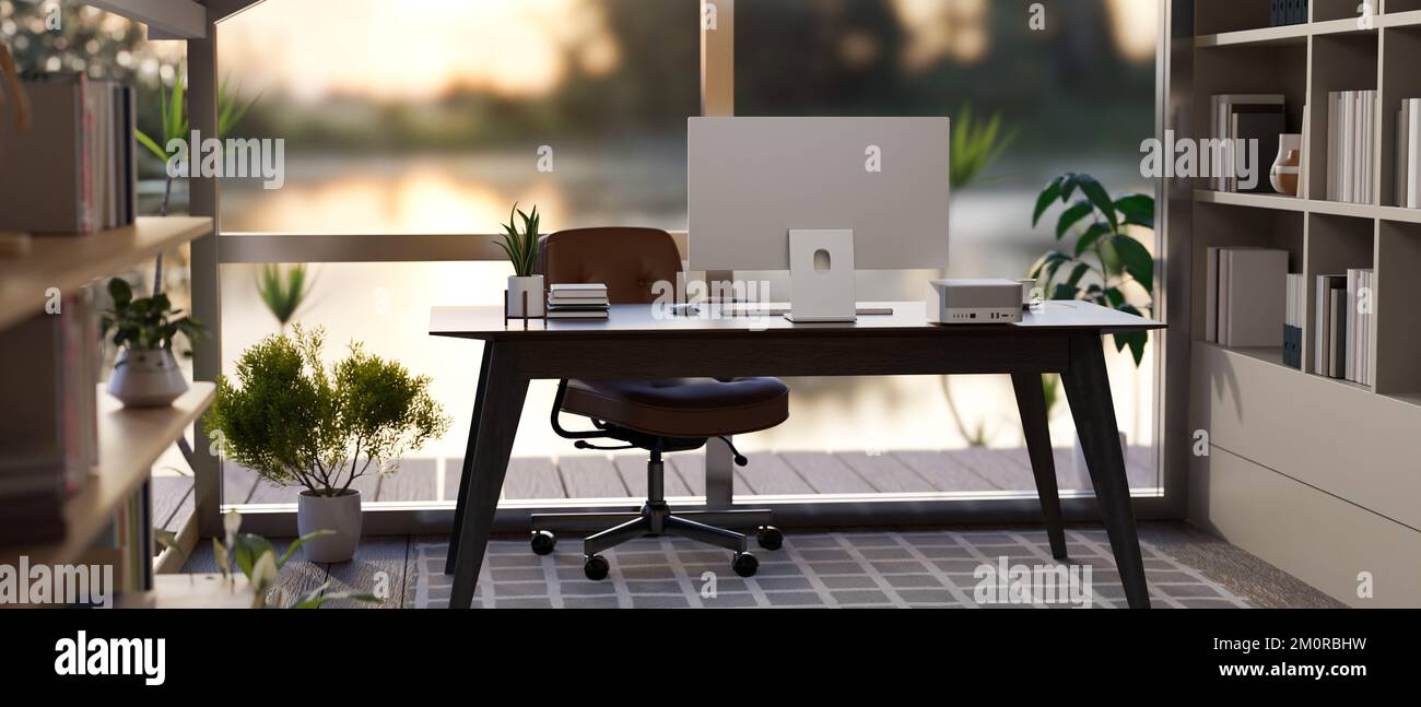 Intérieur moderne et contemporain pour bureau à domicile ou bureau privé avec ordinateur et décor sur table devant le mur en verre, chaise de bureau, étagères A. Banque D'Images