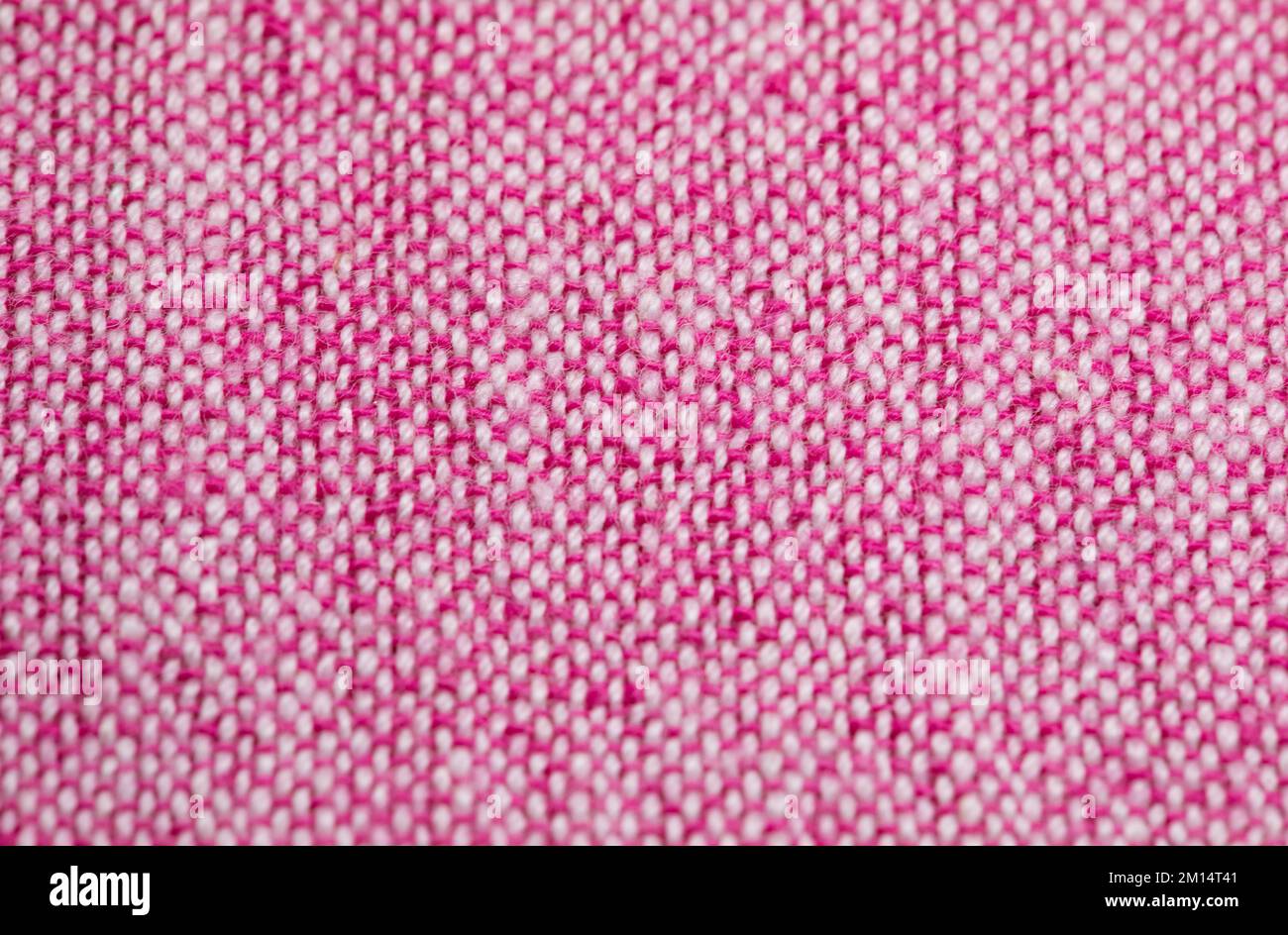 Gros plan sur la texture du tissu rose. Texture de lin naturel rose. Banque D'Images