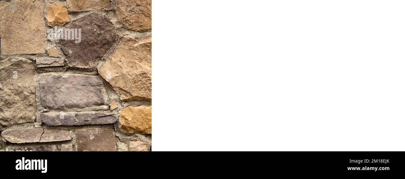 Solide mur en pierre de couleur jaune et beige, idéal pour les arrière-plans, sans couture, maquette de bannière dessing d'affiche Banque D'Images