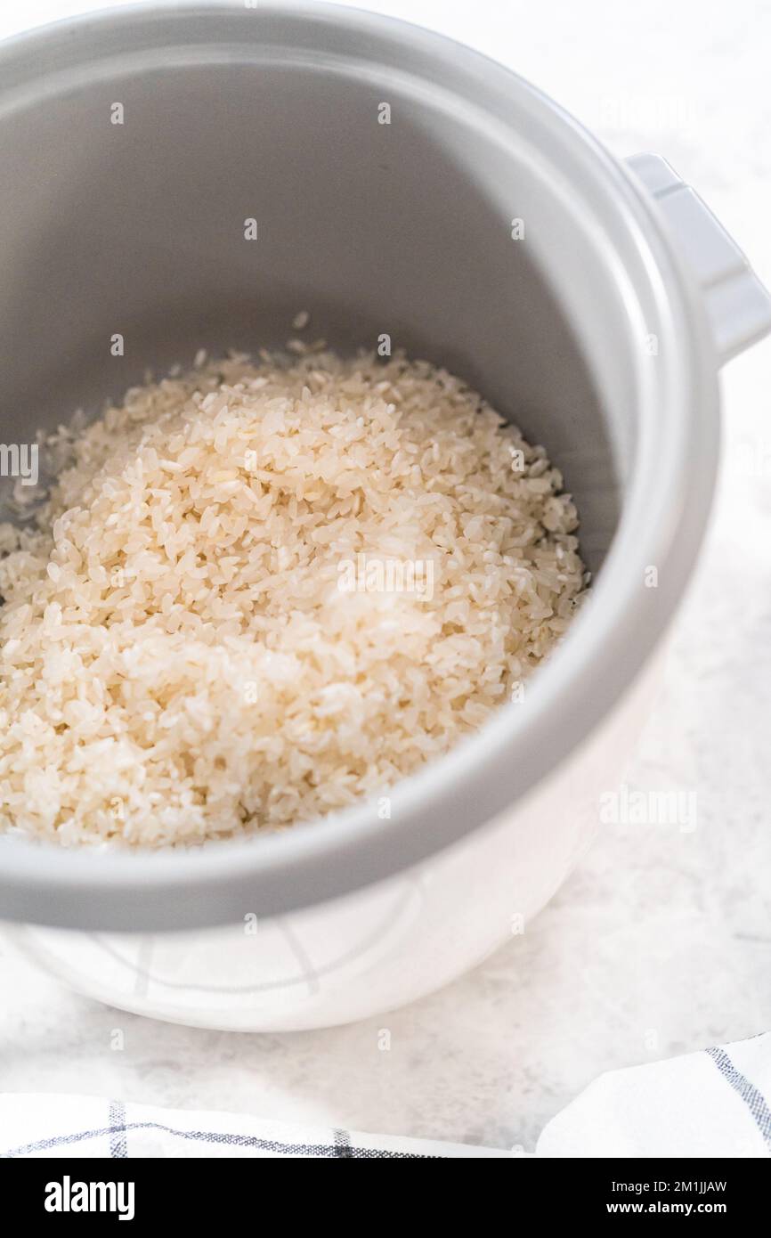 Cuisson du riz Banque D'Images Cuisson du riz Banque D'Images