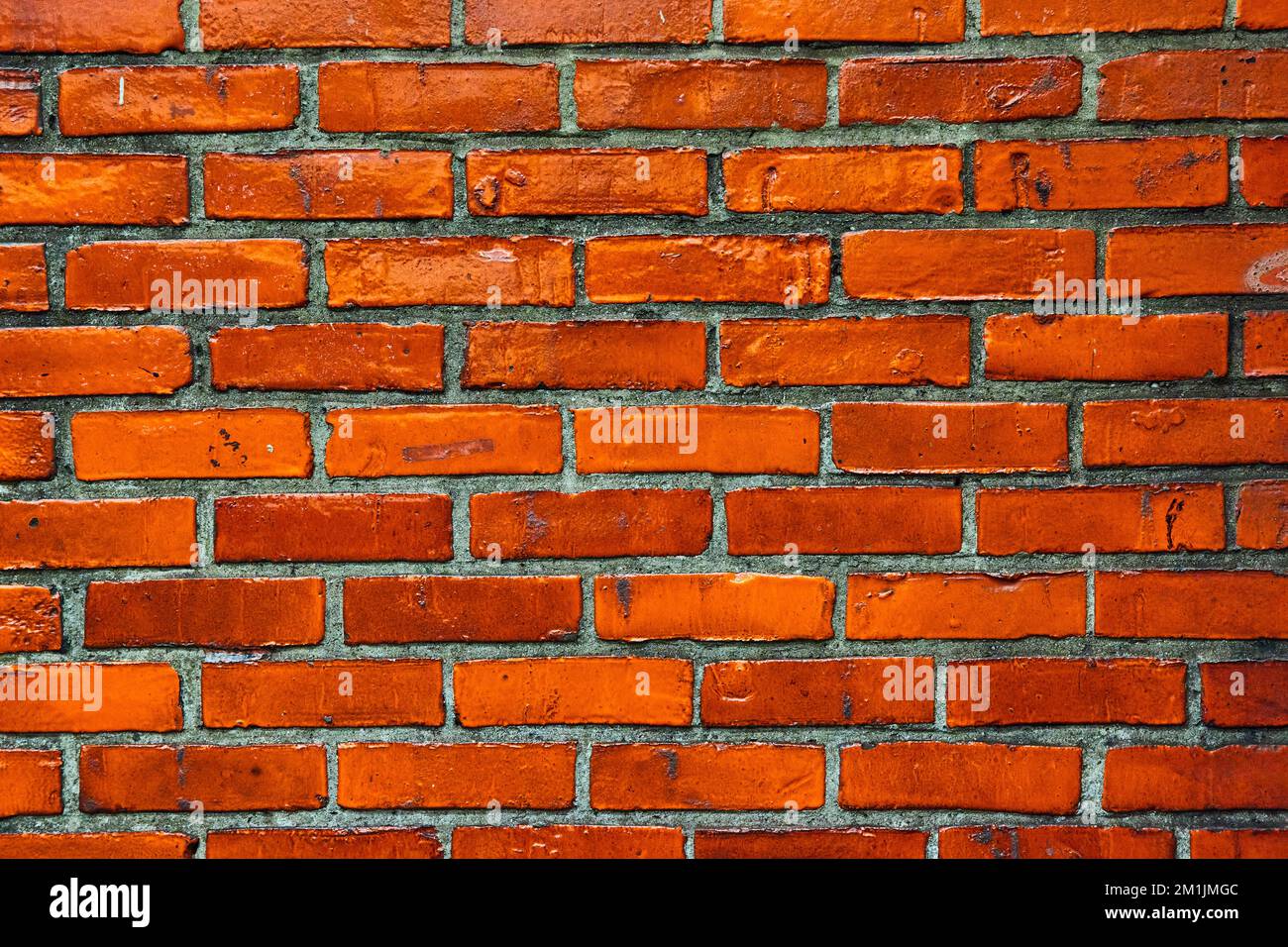 Détail mural en brique orange vif avec mortier gris foncé Banque D'Images