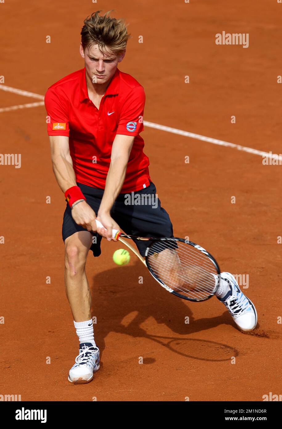 20120914 - BRUXELLES, BELGIQUE: David Goffin belge en action pendant le deuxième match de la coupe Davis entre la Belgique et la Suède, pour le Groupe mondial au Royal Primerose tennis Club à Bruxelles, le vendredi 14 septembre 2012. David Goffin belge (ATP 56) et Andreas Vinciguerra suédois jouent le deuxième des cinq matchs. BELGA PHOTO VIRGINIE LEFOUR Banque D'Images