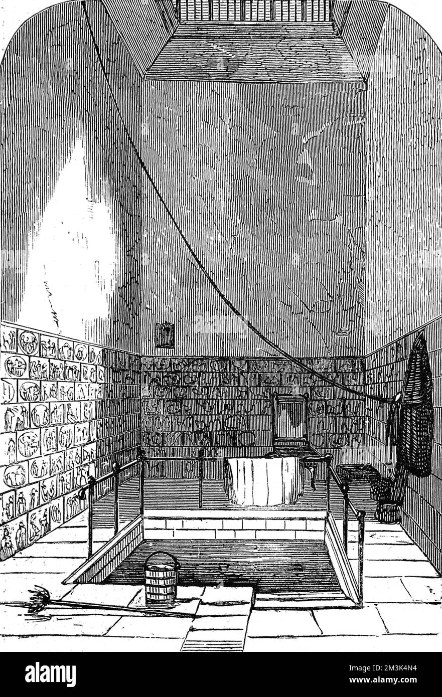 'Queen Anne's Bath' au sous-sol d'une maison de résidence à Endell Street, Londres, 1859. Une fois construit, bordé de tuiles de porcelaine hollandaises, ce bain représentait un assez luxueux, mais était devenu une « relique ancienne » en 1859. 1859 Banque D'Images