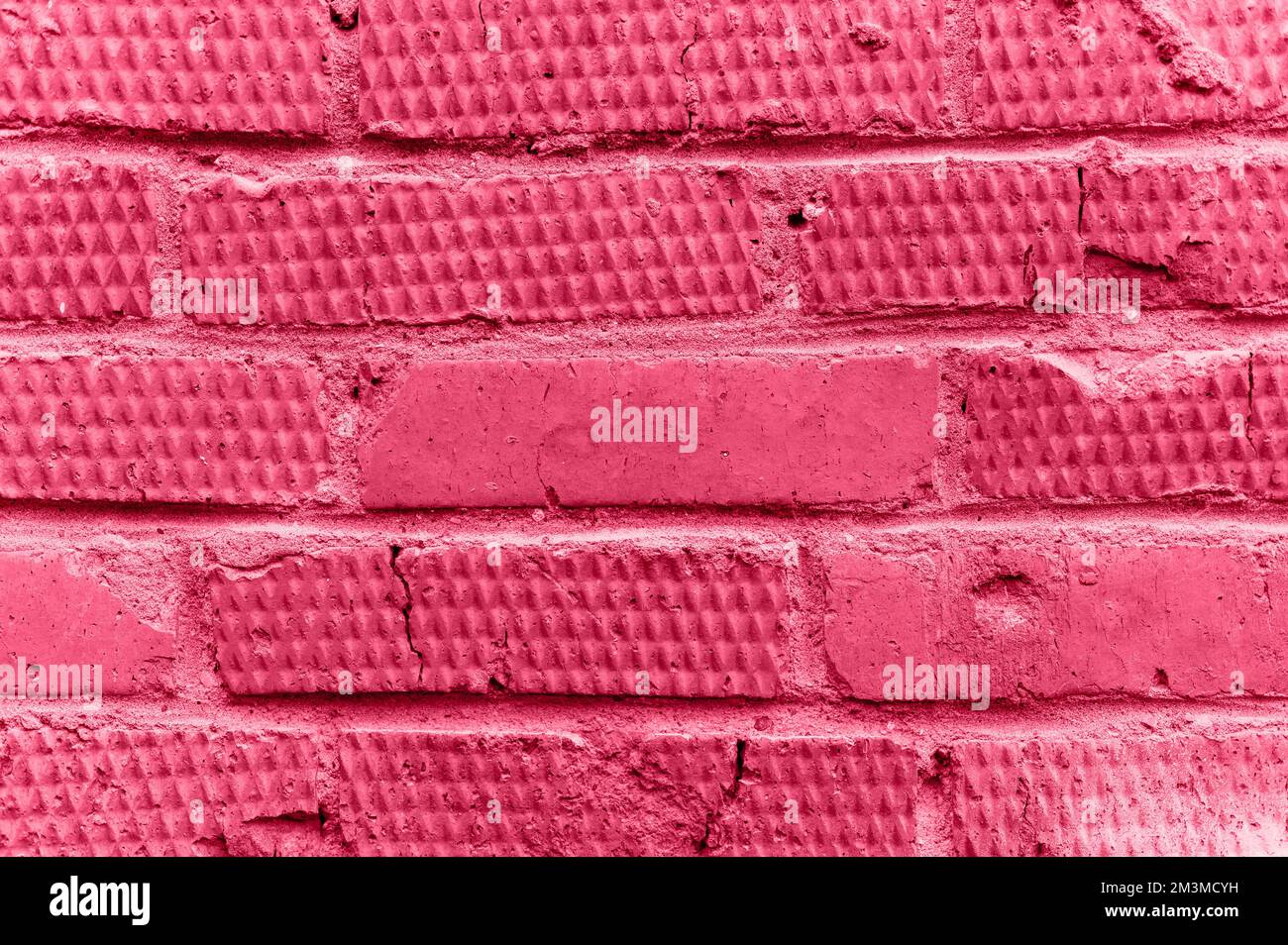 arrière-plan de la brique de relief texturée rose. vieux mur en pierre ou la texture de la rue bloque la toile de fond de près. conception de construction à motif. tonne Banque D'Images