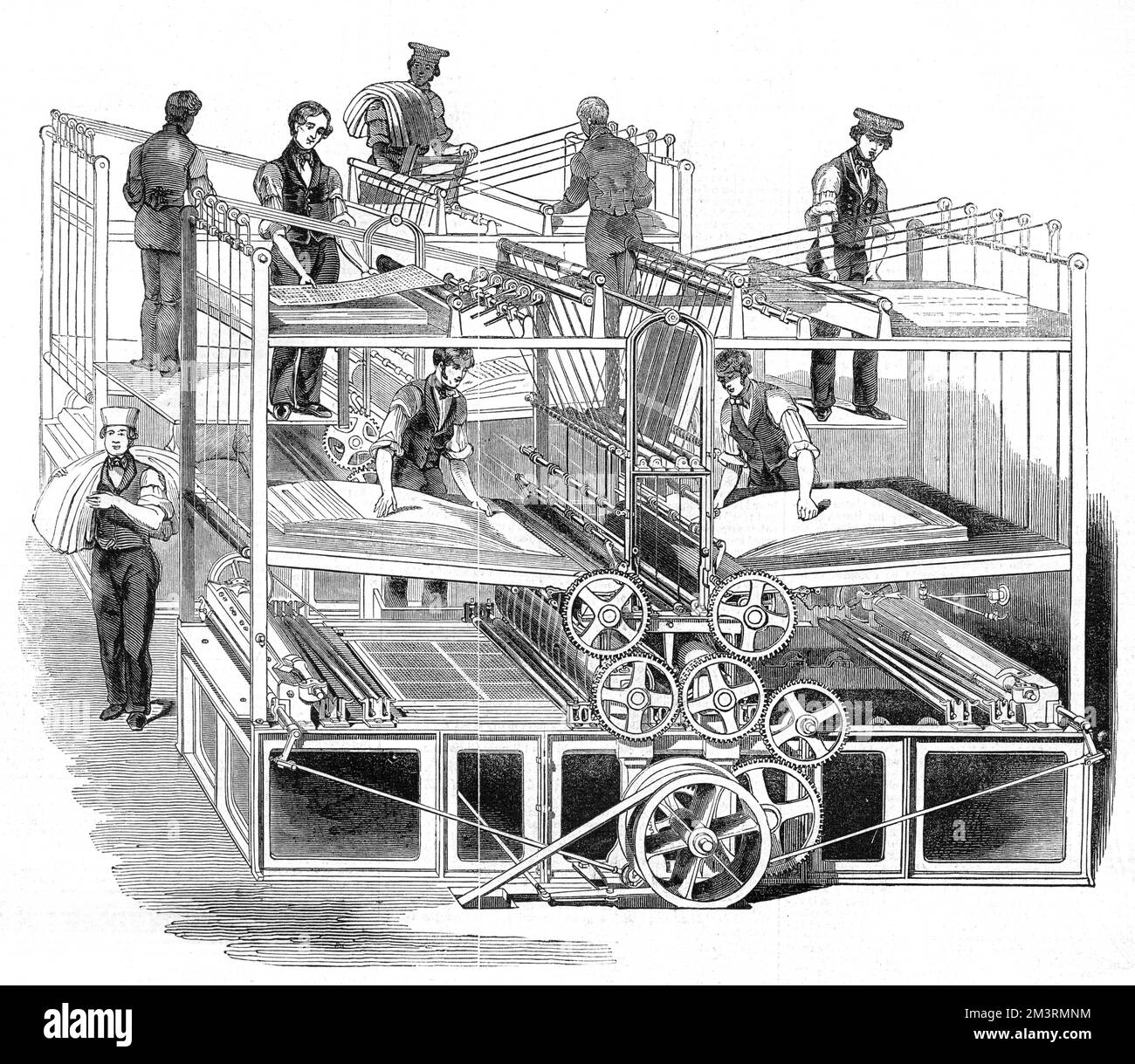 Machines à imprimer à vapeur utilisées par le périodique hebdomadaire, The Illustrated London News. Il y avait deux machines distinctes, l'une pour l'impression d'une face du papier et l'autre pour l'impression de l'autre. Ces machines étaient alimentées par un moteur à vapeur de six chevaux. Chaque machine se composait d'une grande table de traversée soutenue dans un cadre de fer, et quatre cylindres, deux d'acajou, deux de fer. 1843 Banque D'Images