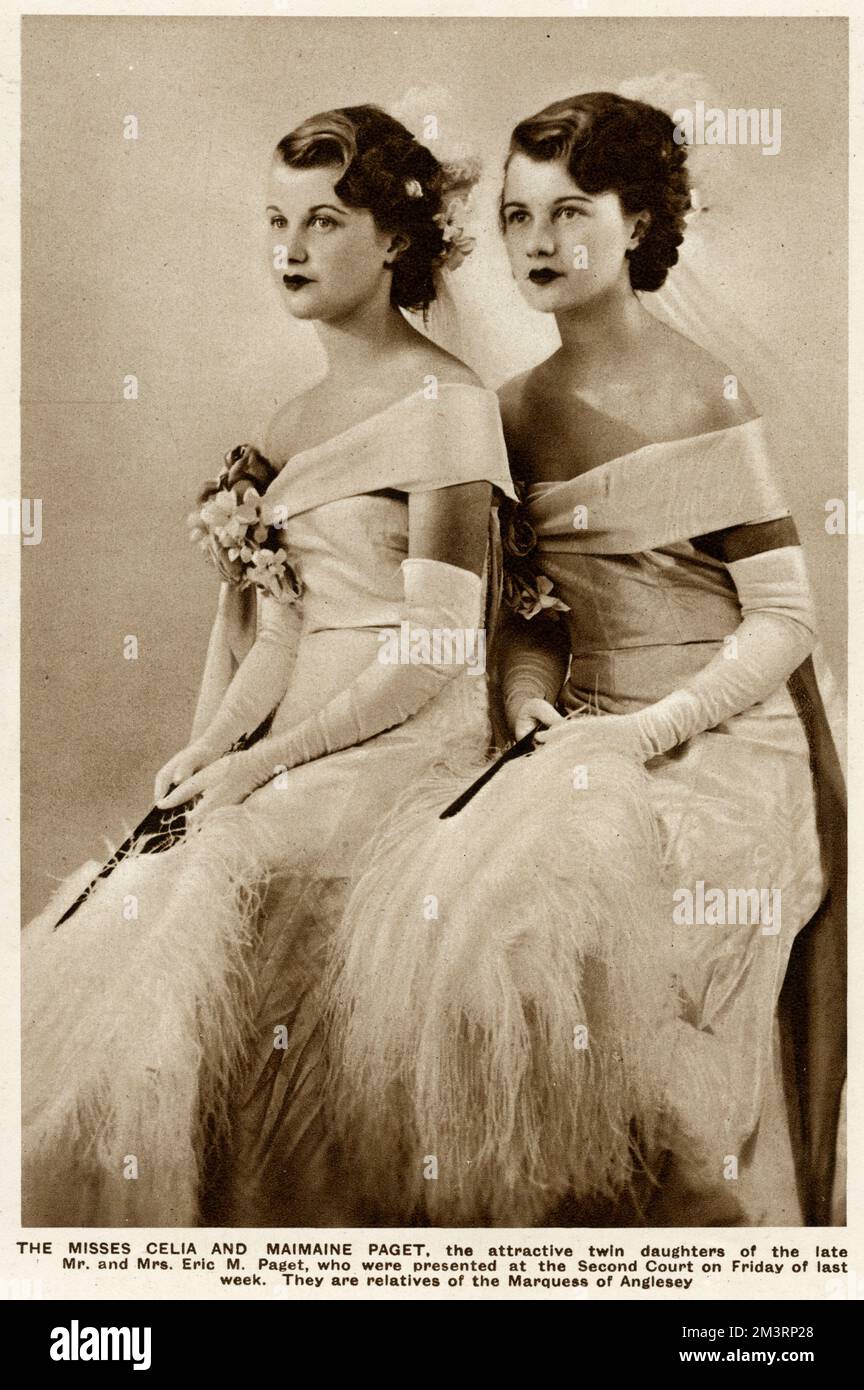 Mlle Celia et Maimaine Paget, les filles jumelles de M. et de Mme Eric M. Paget dans leurs robes de cour. Ils ont été présentés à la deuxième Cour de 1935. Date: 1935 Banque D'Images