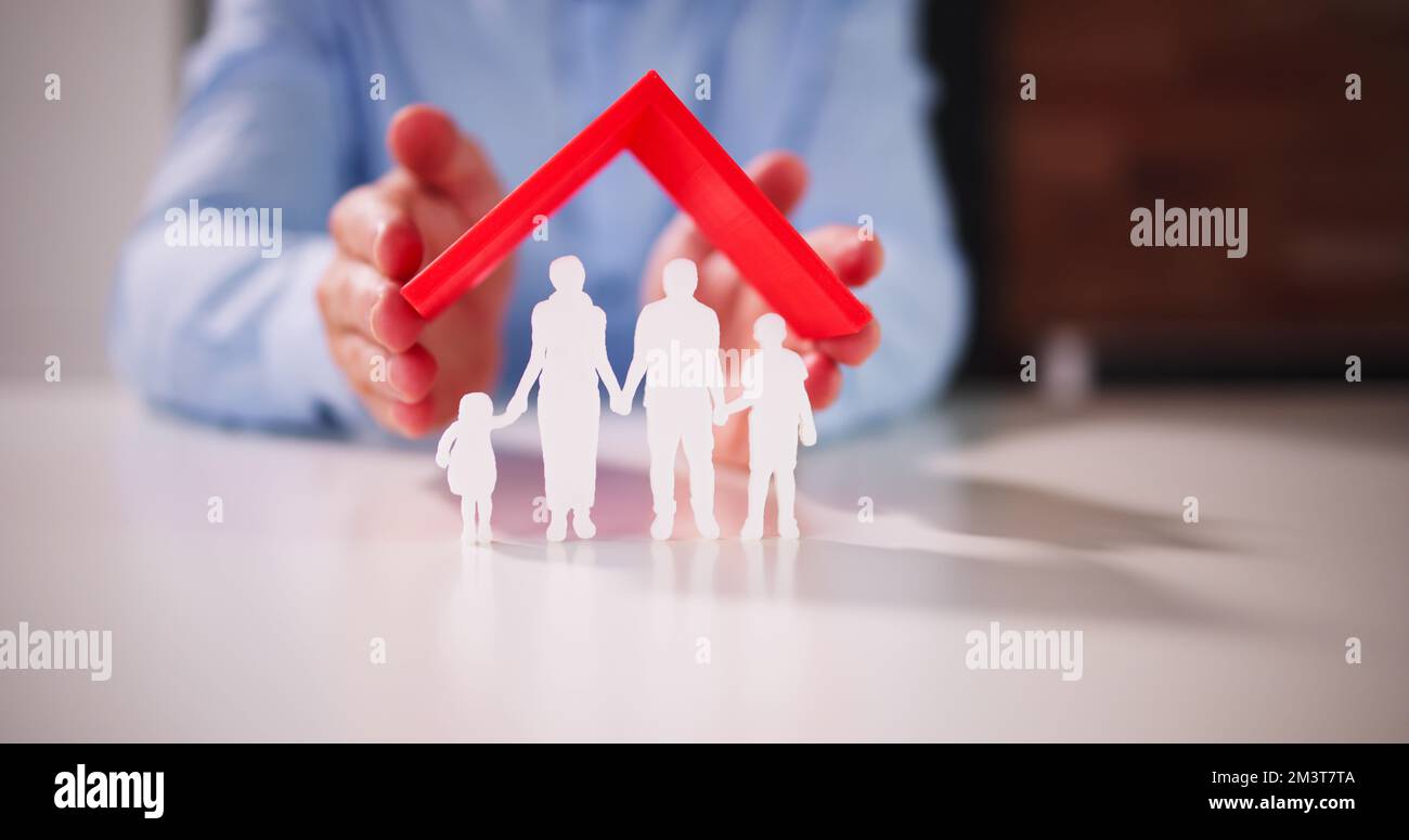 Protection d'assurance familiale et toit ou abri Banque D'Images