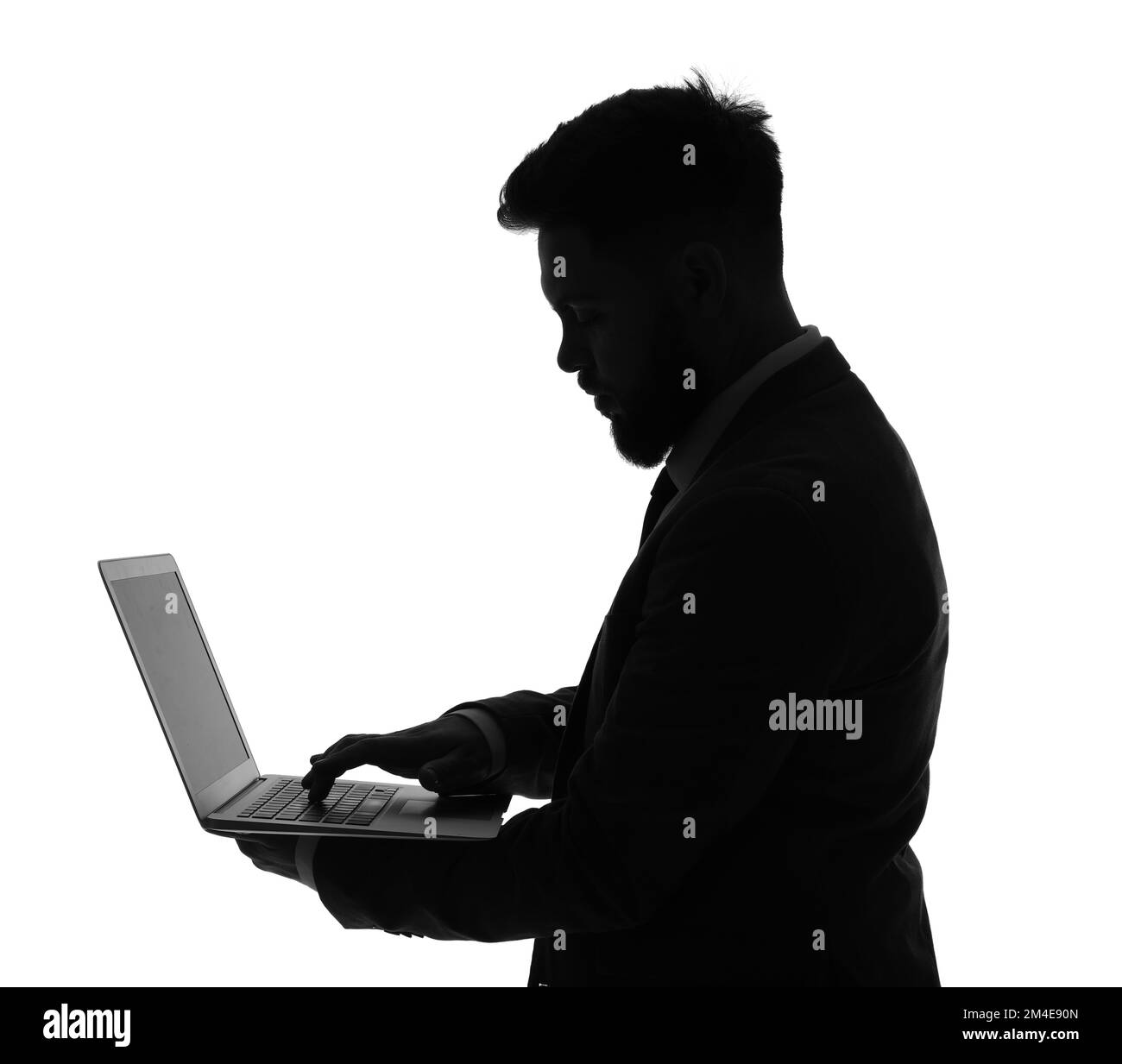 Silhouette d'homme d'affaires utilisant un ordinateur portable sur fond blanc Banque D'Images