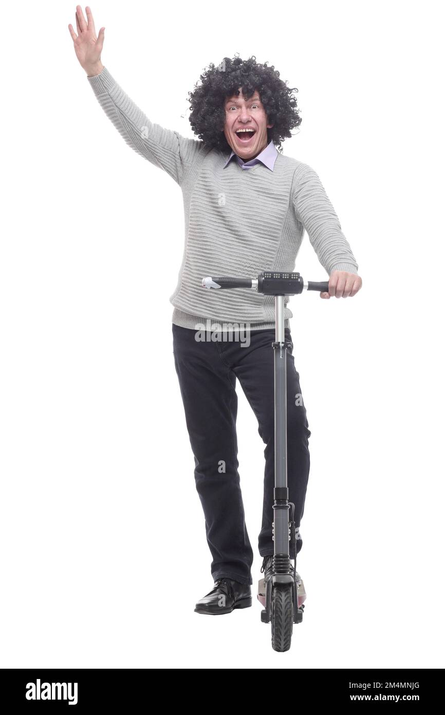 en pleine croissance. homme joyeux avec un scooter électrique. Banque D'Images