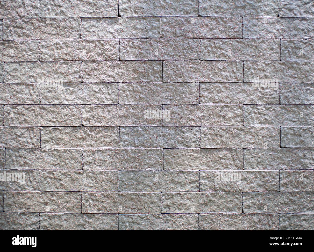 l'arrière-plan du motif est une brique grise Banque D'Images