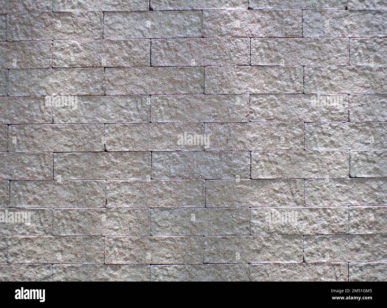 l'arrière-plan du motif est une brique grise Banque D'Images