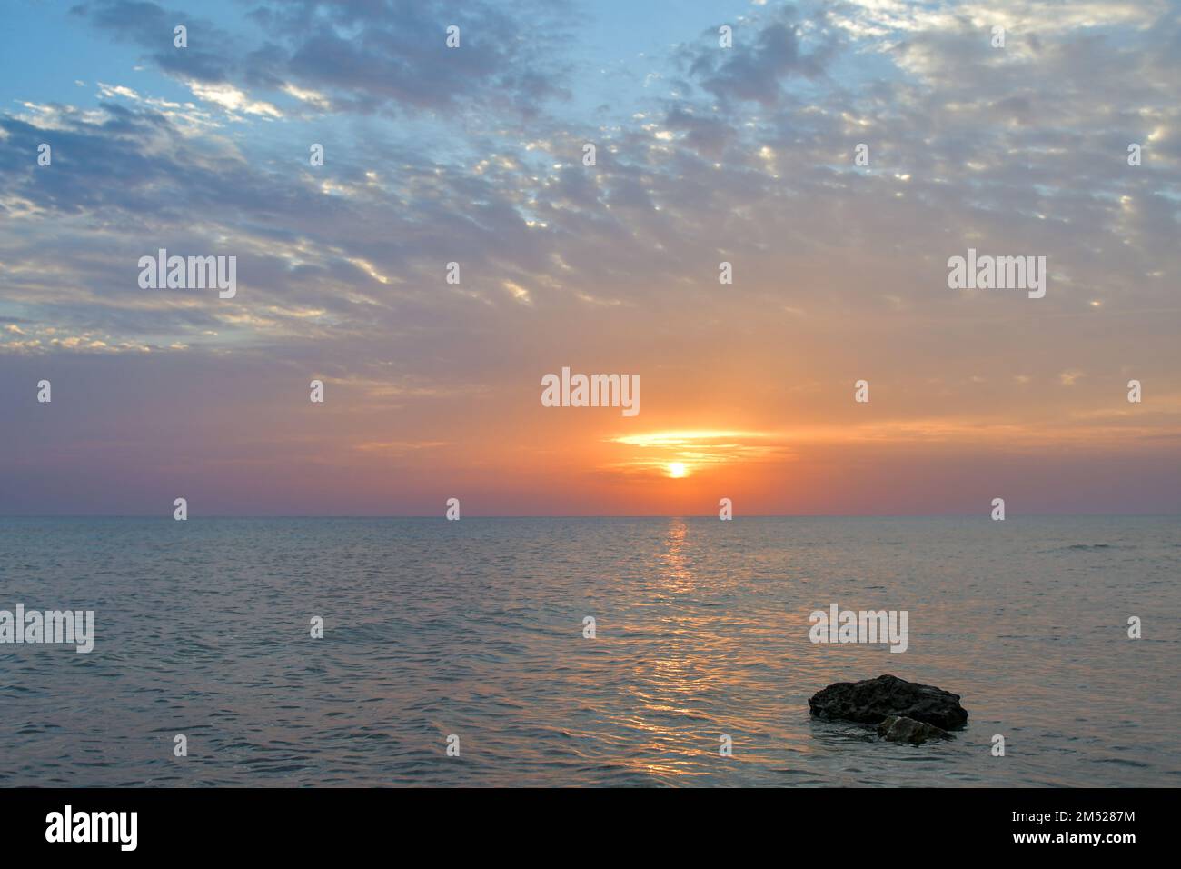 Coucher de soleil et lever de soleil sur la plage Banque D'Images