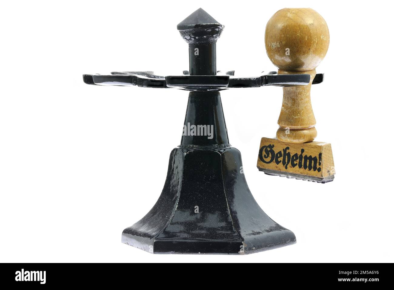 Timbre en caoutchouc vintage avec le mot allemand « Geheim! » (confidentiel) sur le carrousel de timbres Banque D'Images