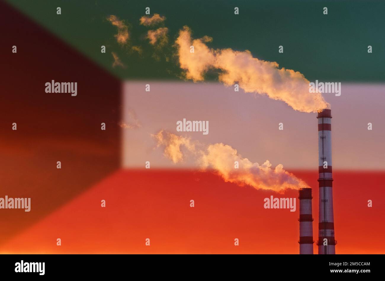 Concept écologique. Sur fond de pavillon du Koweït, la fumée des cheminées d'une entreprise industrielle coule, polluant l'air. Banque D'Images
