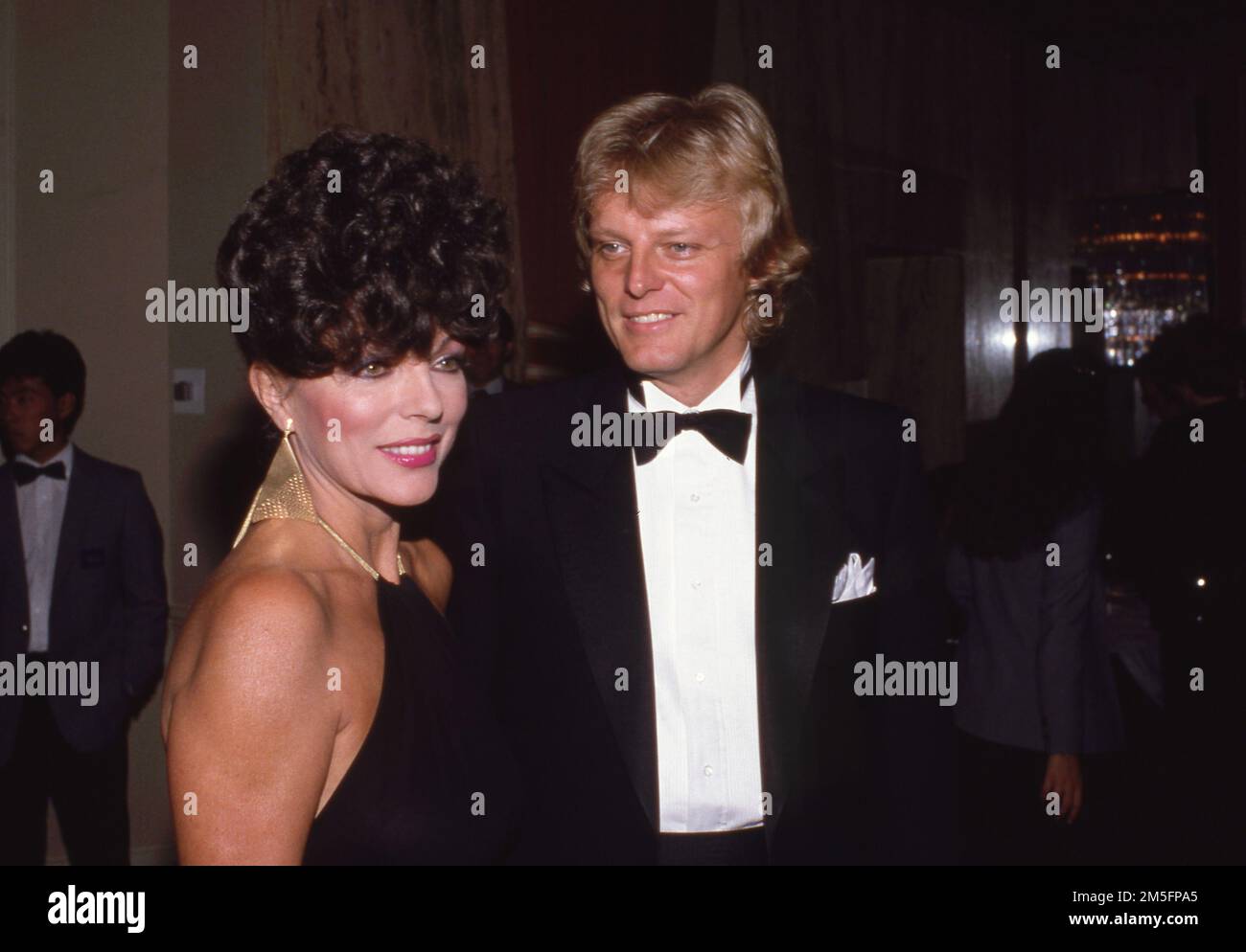 Joan Collins et Peter Holm Circa années 1980 crédit: Ralph Dominguez/MediaPunch Banque D'Images