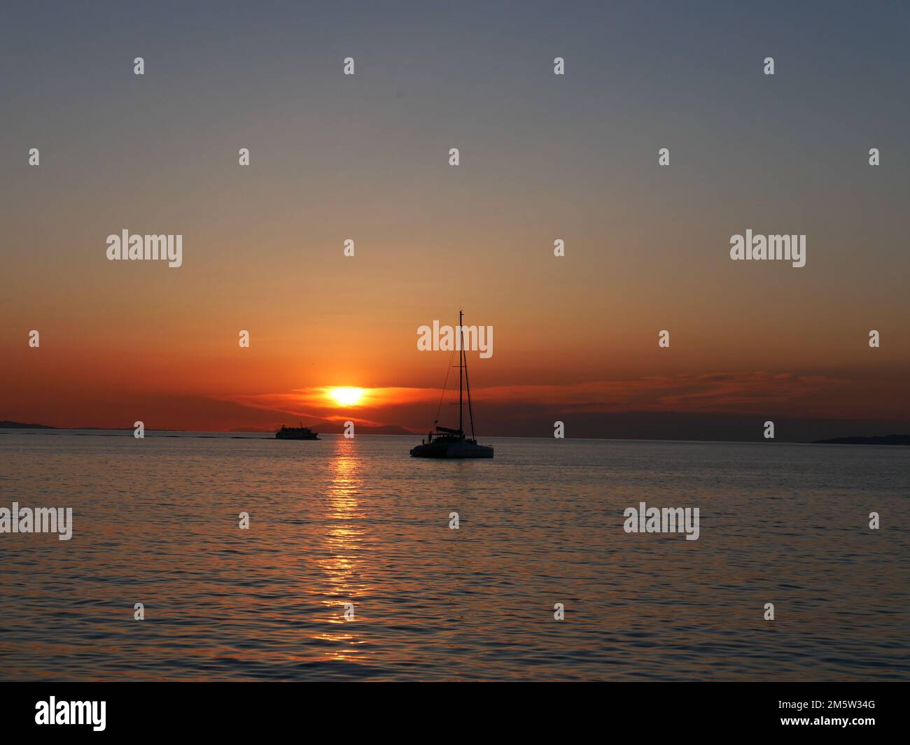 Coucher de soleil vu de la petite Venise, Mykonos, Grèce Banque D'Images