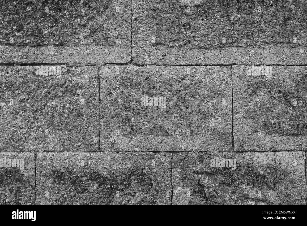 Texture brique pierre. Surface dure. Arrière-plan abstrait. Gros plan noir et blanc Banque D'Images