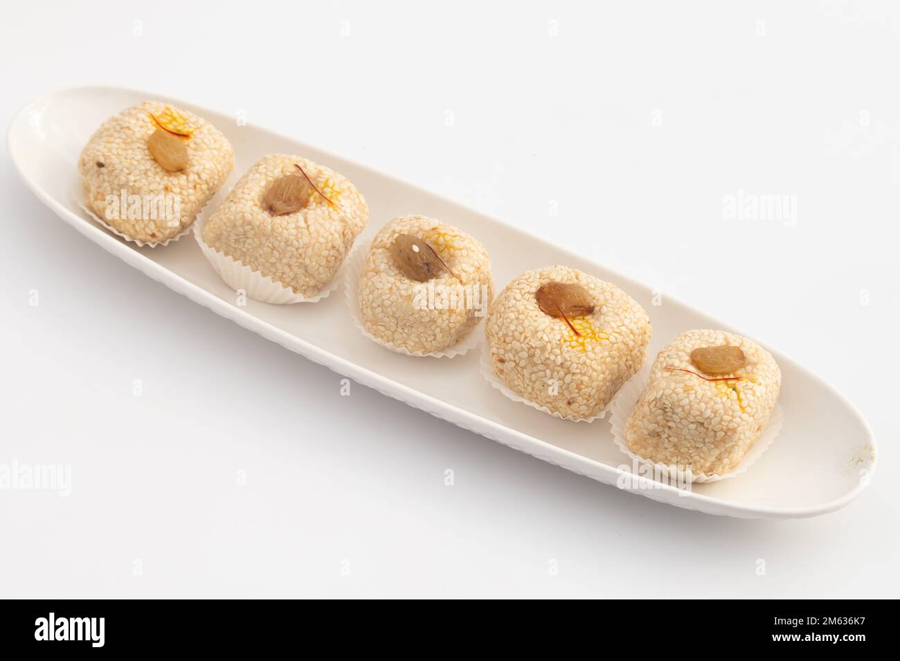 Saison d'hiver spécial Punjabi traditionnel Mithai jusqu'à Bhugga ou Til Bugga est fait de graines de sésame grillées à sec avec Mava, Khoya, Jaggery, Mawa, gord, Des Banque D'Images