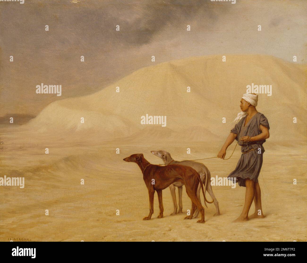 Jean-Léon Gérame - sur le désert - deux chiens de chasse sont à pied par un Nubien dans le désert. Banque D'Images