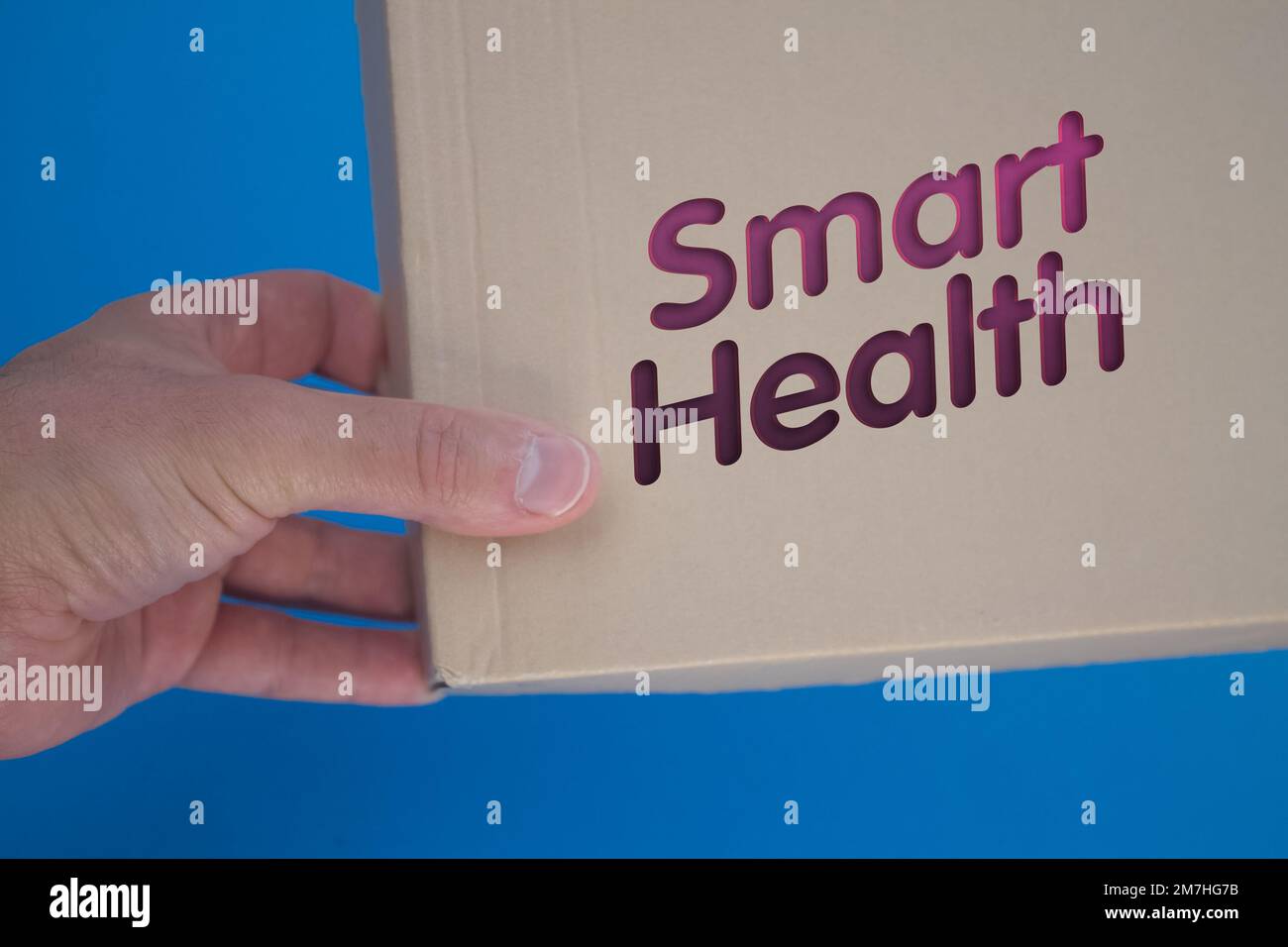 Mot Smart Health avec boîte en carton. Boîte à cartes pliée marron. Banque D'Images