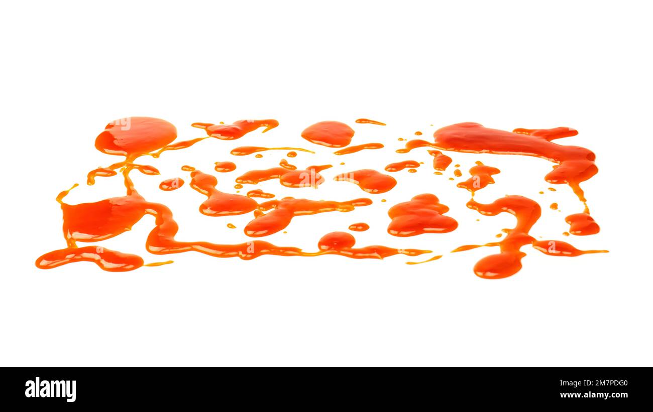 Éclaboussures de sauce orange isolées sur fond blanc A. Vue de dessus. Banque D'Images