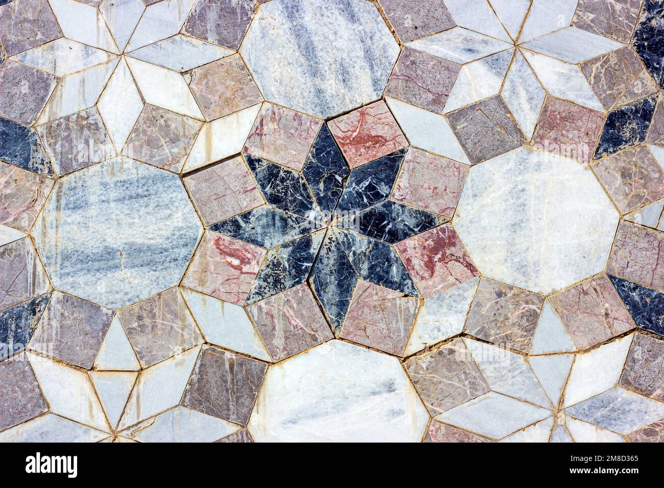 Carrelage en céramique de marbre gris vintage arrière-plan texturé sur l'ancien mur en brique de pierre de bâtiment. Banque D'Images