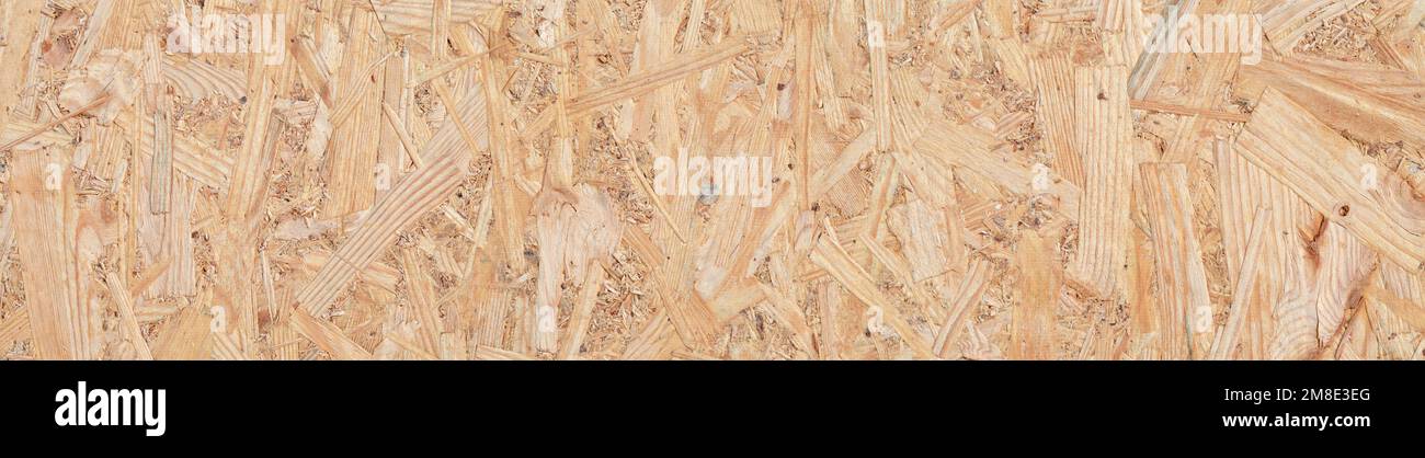 Texture de la surface du panneau OSB comme arrière-plan abstrait avec espace. Banque D'Images
