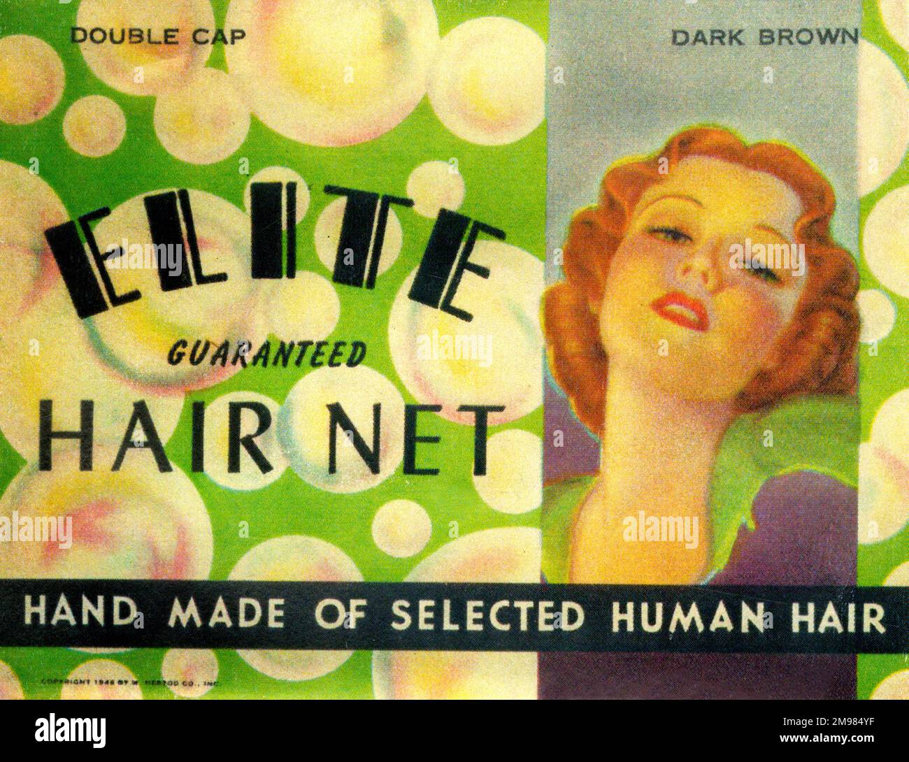 Hairnet vintage Packaging - Elite Hair Net - double cap en brun foncé - 'fait main de certains cheveux humains'. Banque D'Images