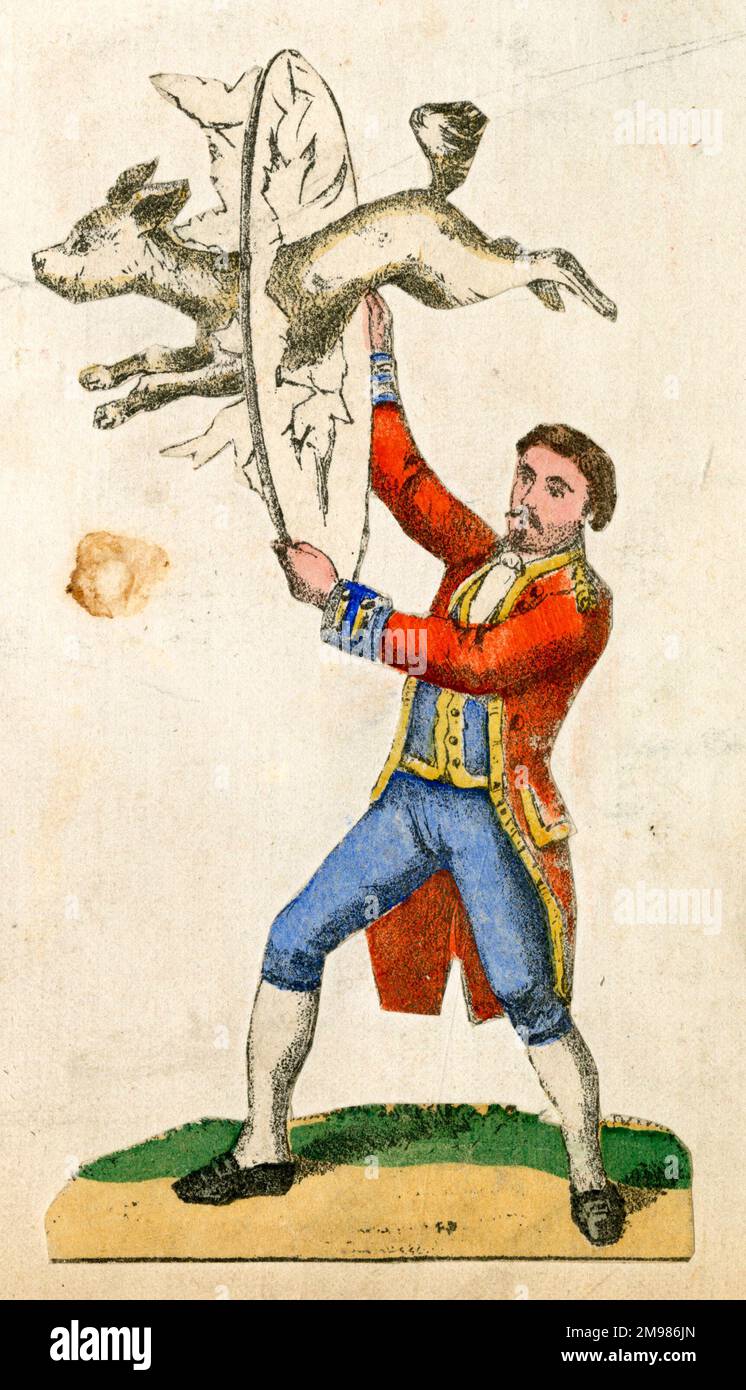 Le cirque allemand de ferraille -- chien sautant à travers un panier de papier. Banque D'Images