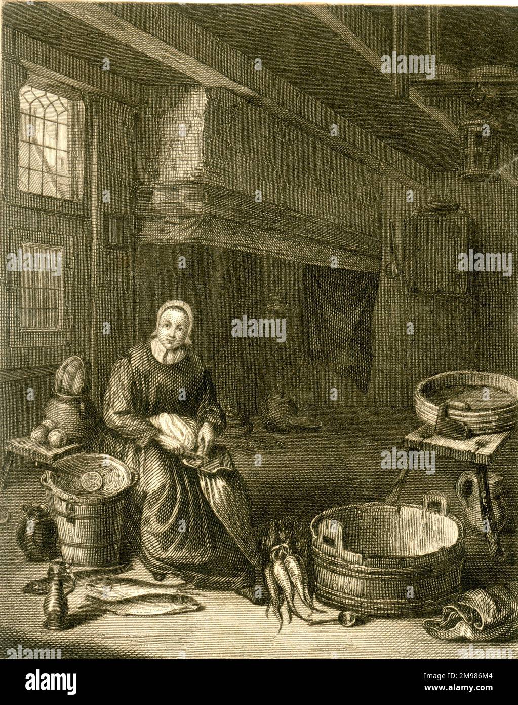 Femme au travail dans une cuisine flamande. Banque D'Images