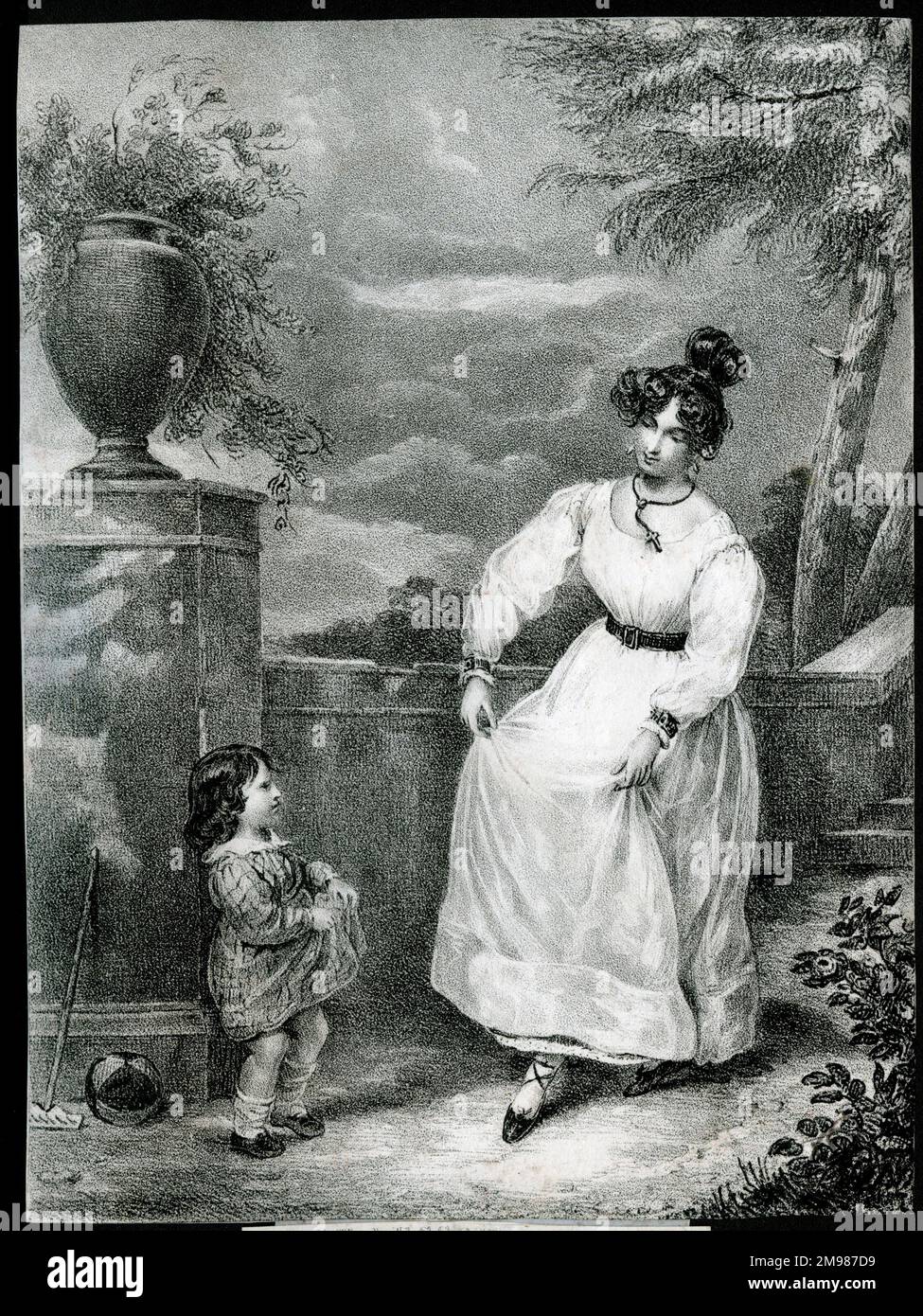 Première leçon de danse - mère et enfant dans un jardin. Banque D'Images