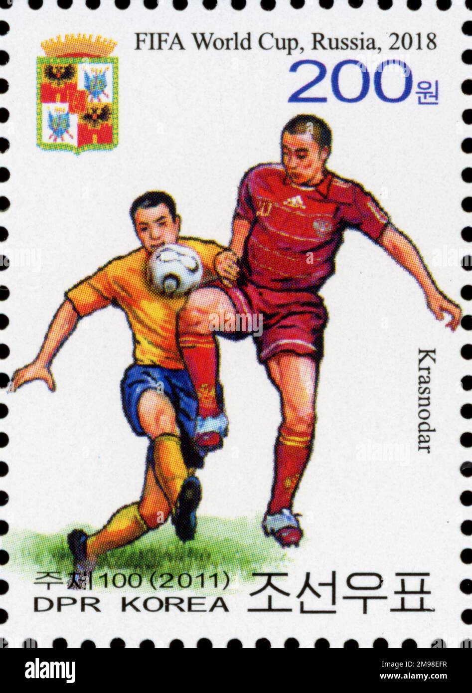 Timbre-poste nord-coréen de 2011 commémorant la Coupe du monde de la FIFA 2018 en Russie, représentant des joueurs de football et le nom de la ville de Krasnodar. Banque D'Images