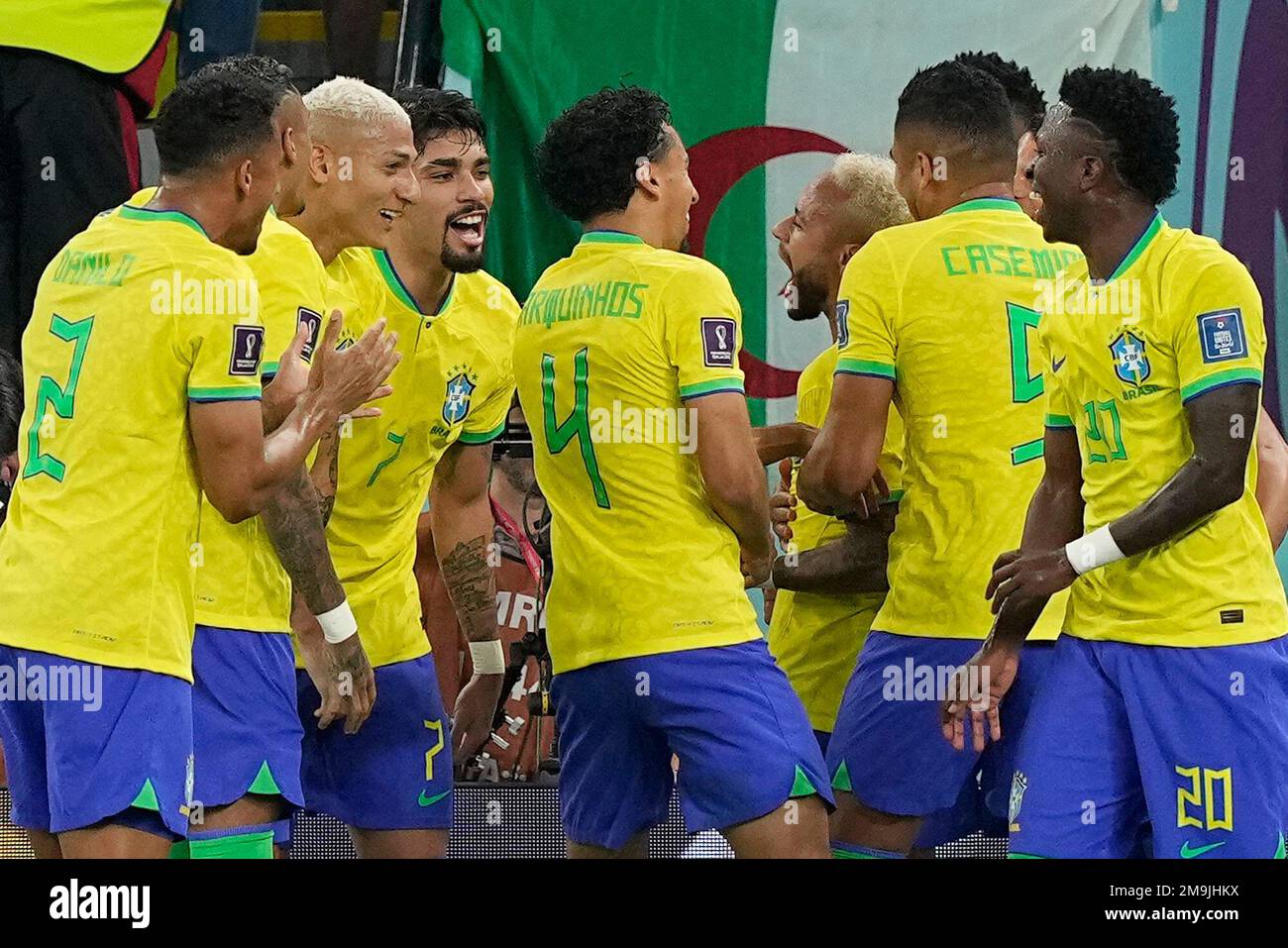 Brazil's Neymar, center right, celebrates after scoring his side's second goal from the penalty spot during the World Cup round of 16 soccer match between Brazil and South Korea, at the Stadium 974 in Doha, Qatar, Monday, Dec. 5, 2022. (AP Photo/Martin Meissner) Banque D'Images