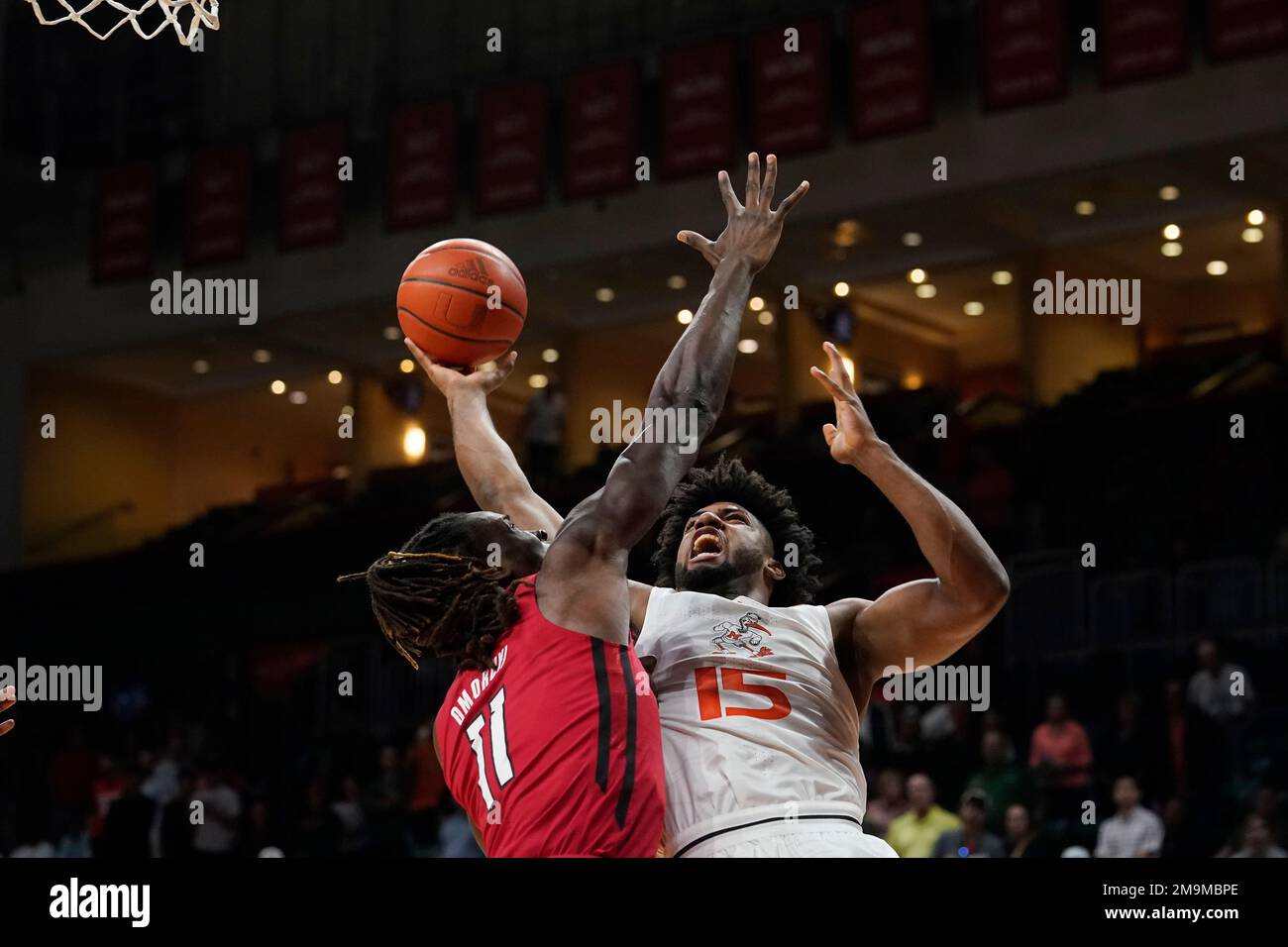 Miami Forward Norchad Omier (15) Drives To The Basket As Rutgers Center ...