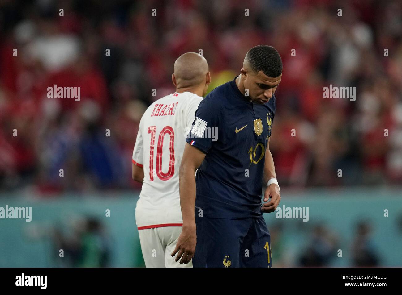 France's Kylian Mbappe, right, and Tunisia's Wahbi Khazri leave after the World  Cup group D soccer match between Tunisia and France at the Education City  Stadium in Al Rayyan , Qatar, Wednesday,