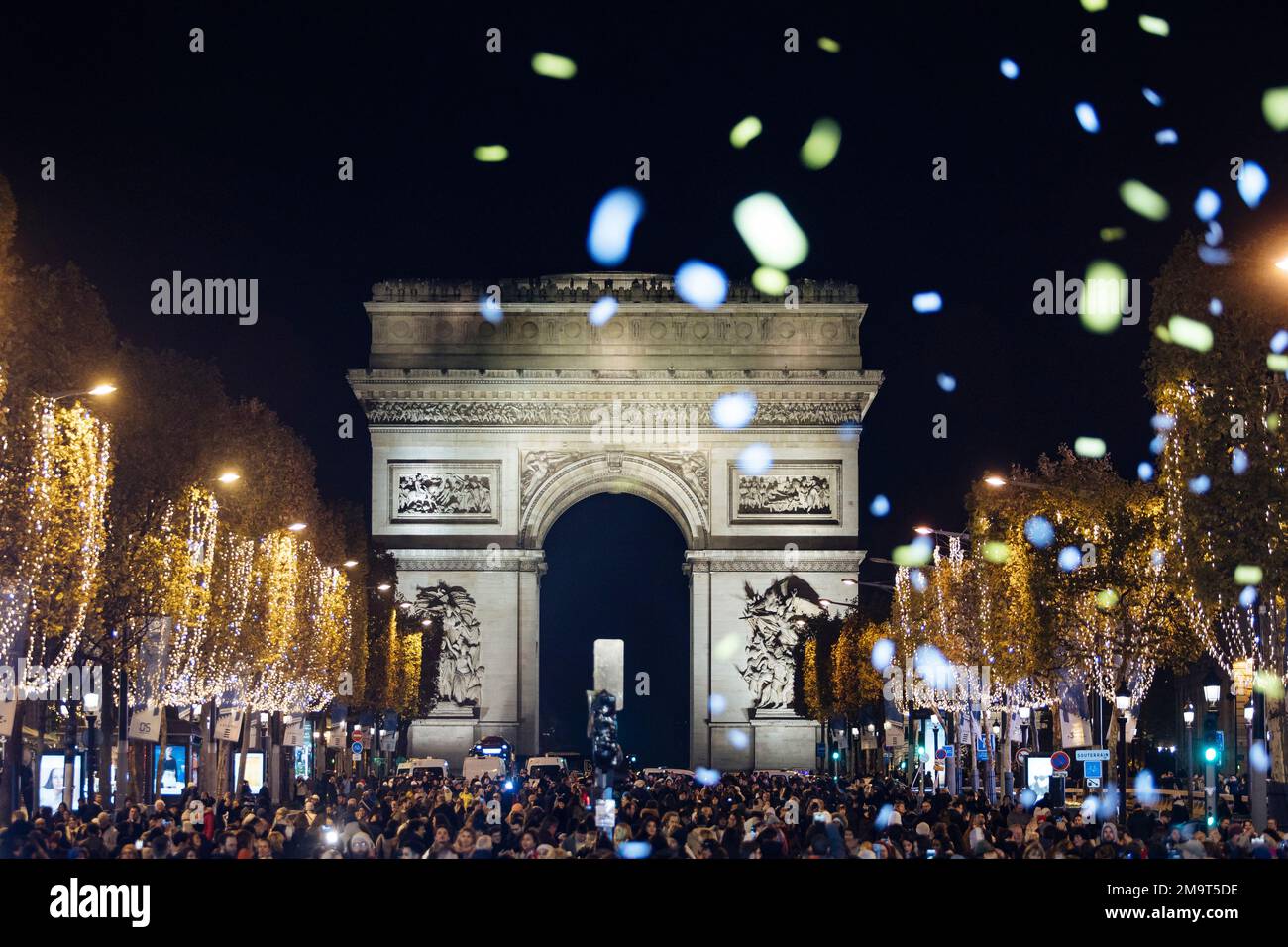 Spectators gather to attend the Champs Elysee Avenue illumination