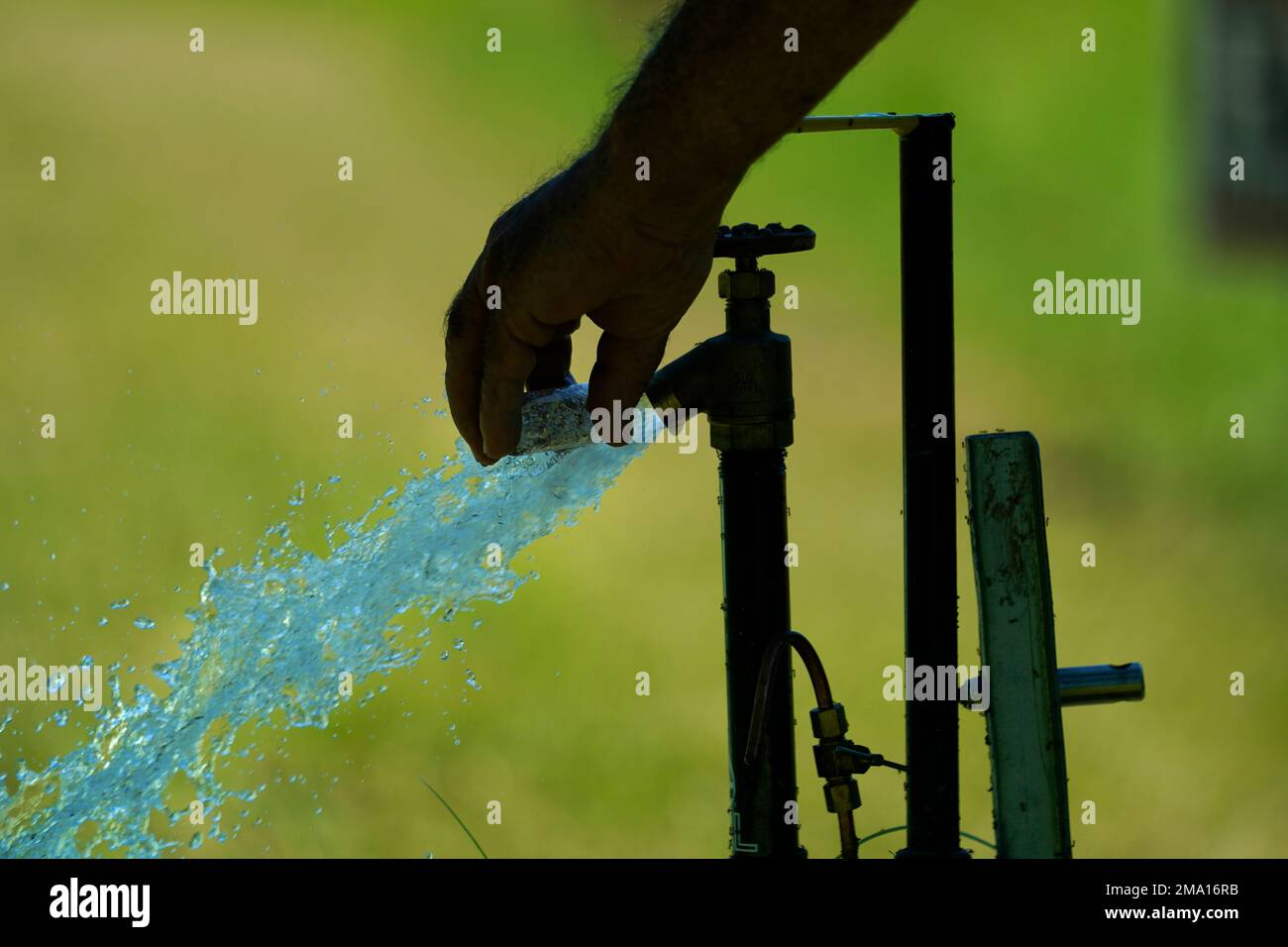 Water plant operator Mike Gandy takes a water sample of the Ferriday