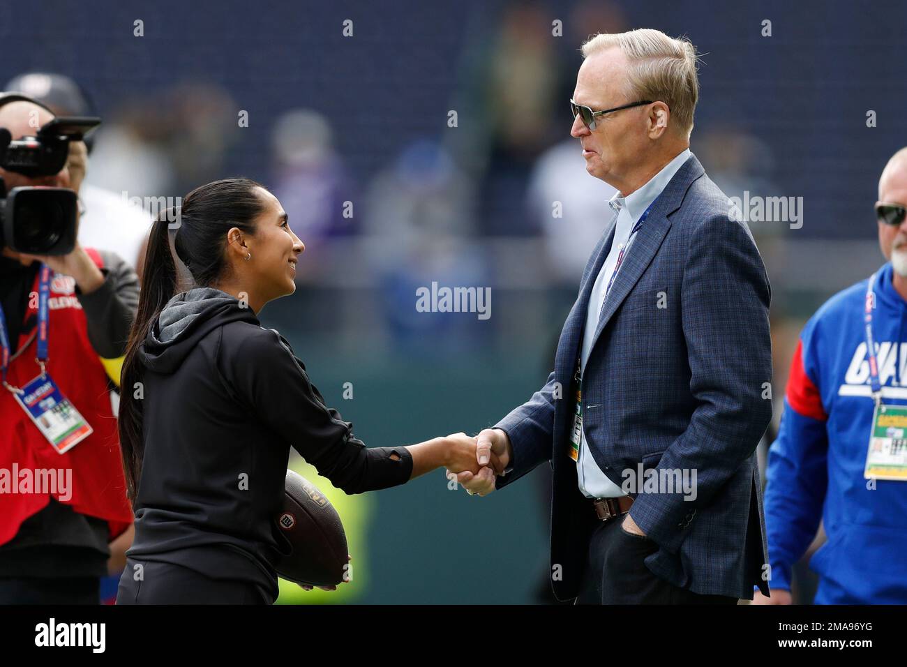 Team Mexico Women's Flag quarterback Diana Flores greets New York Giants  president, CEO, and co-owner John Mara before an NFL football game between  the Green Bay Packers and the New York Giants