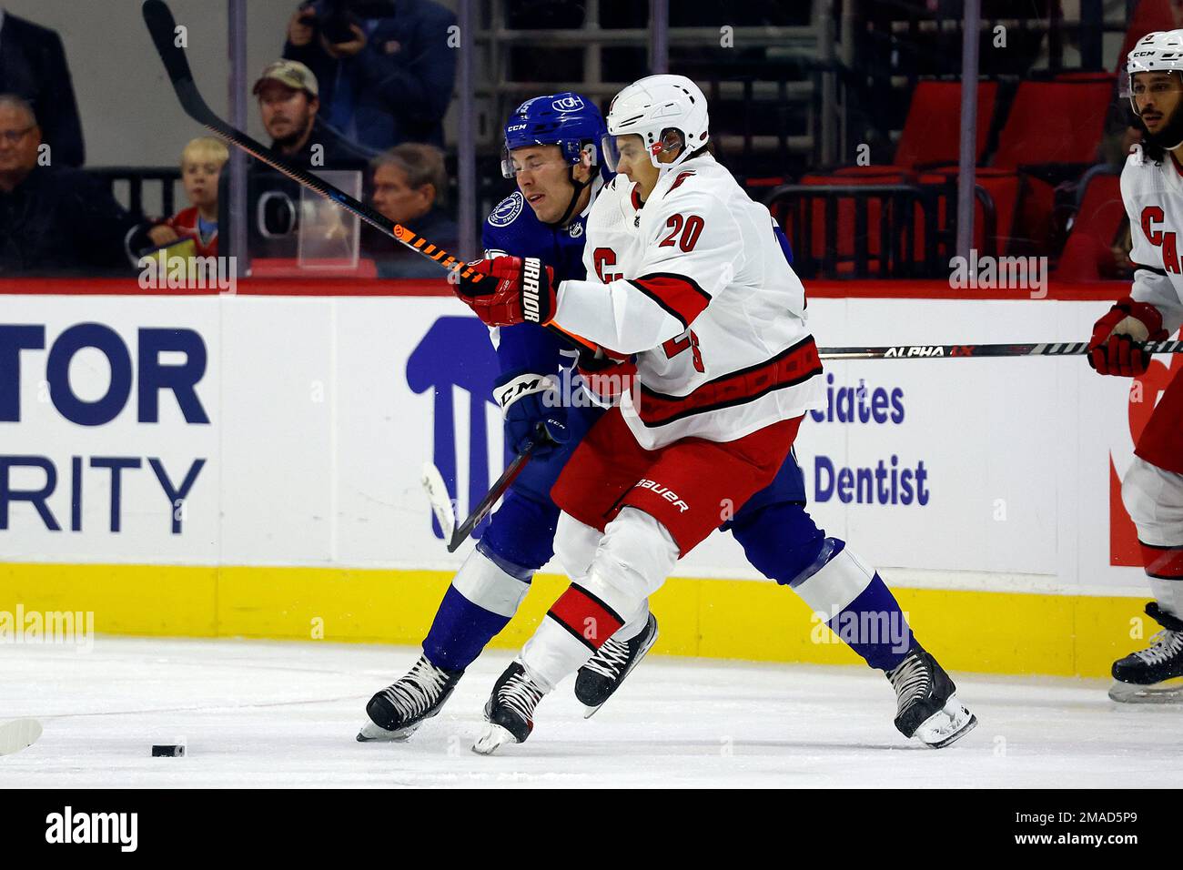 Carolina Hurricanes' Sebastian Aho (20) collides with Tampa Bay
