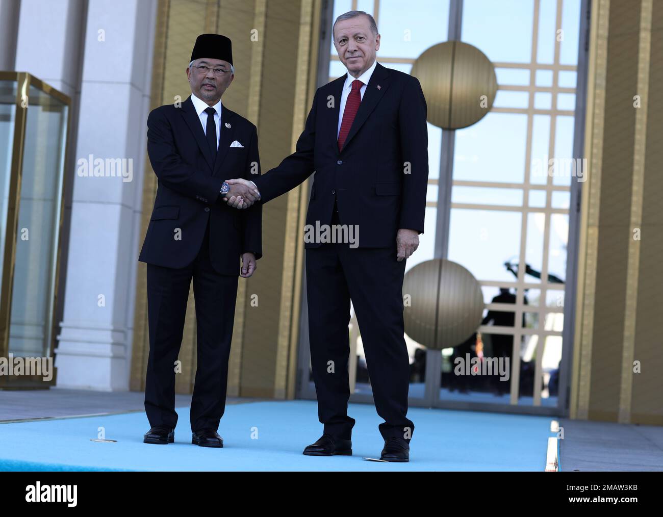 Turkey's President Recep Tayyip Erdogan, right, and Malaysia's King