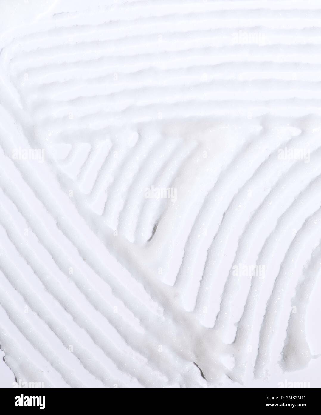 Texture à taches cosmétiques de crème liquide sur un fond blanc Banque D'Images