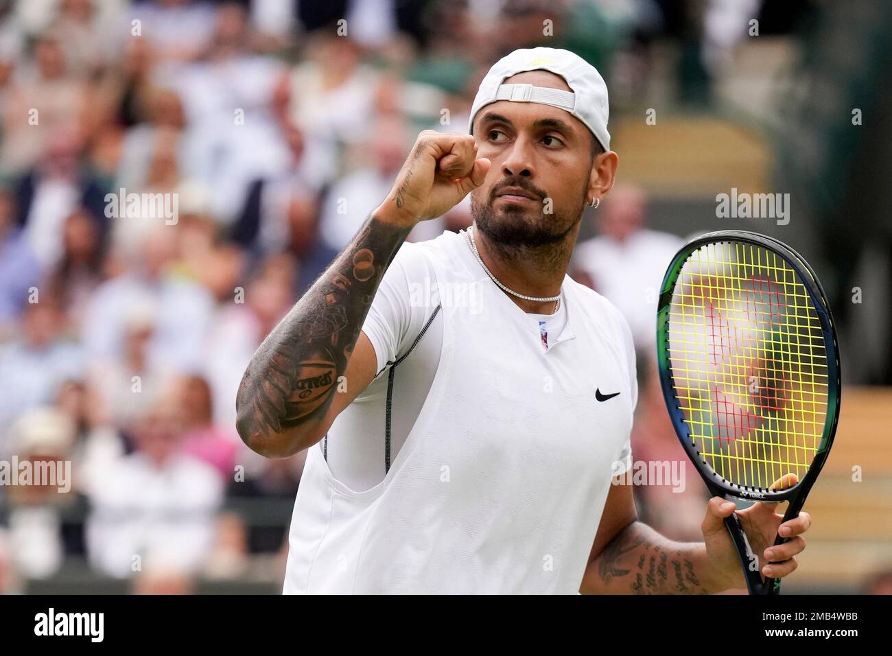 Australia's Nick Kyrgios celebrates winning a point against Chile's Cristian Garin during a men's singles quarterfinal match on day ten of the Wimbledon tennis championships in London, Wednesday, July 6, 2022. (AP Photo/Alberto Pezzali) Banque D'Images