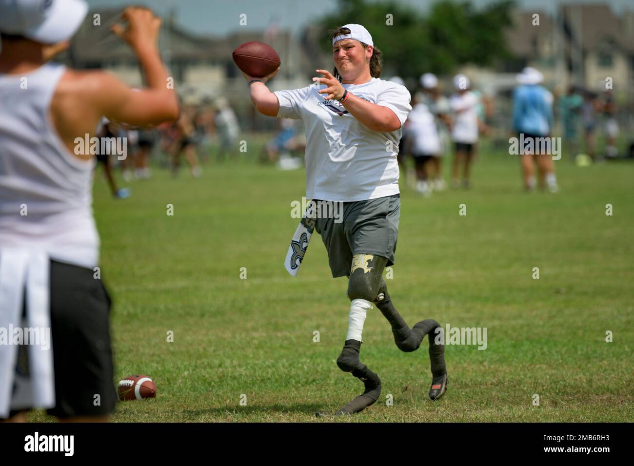 Calder Hodge, 17, a quarterback of Houston Christian High School in Texas,  takes part in the Manning Passing Academy on the Nicholls State University  campus in Thibodaux, La. Saturday, June 25, 2022.