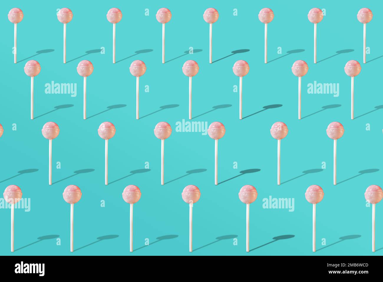 Photo en gros plan d'un lollipop. Photo sur fond bleu. Sucettes isolées. Banque D'Images