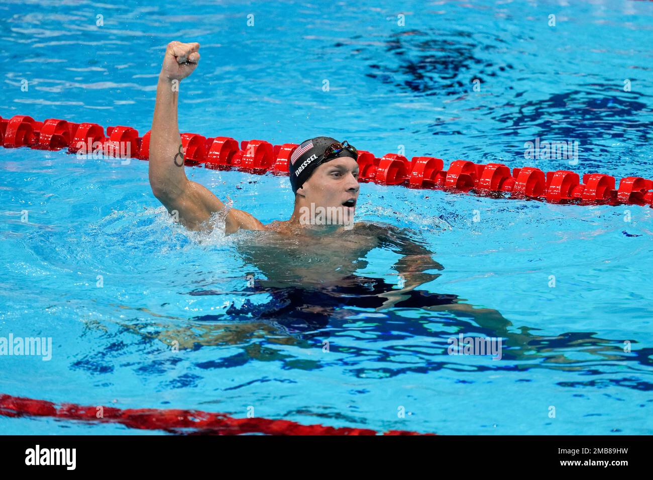 FILE - Caeleb Dressel, of the United States, celebrates after winning ...