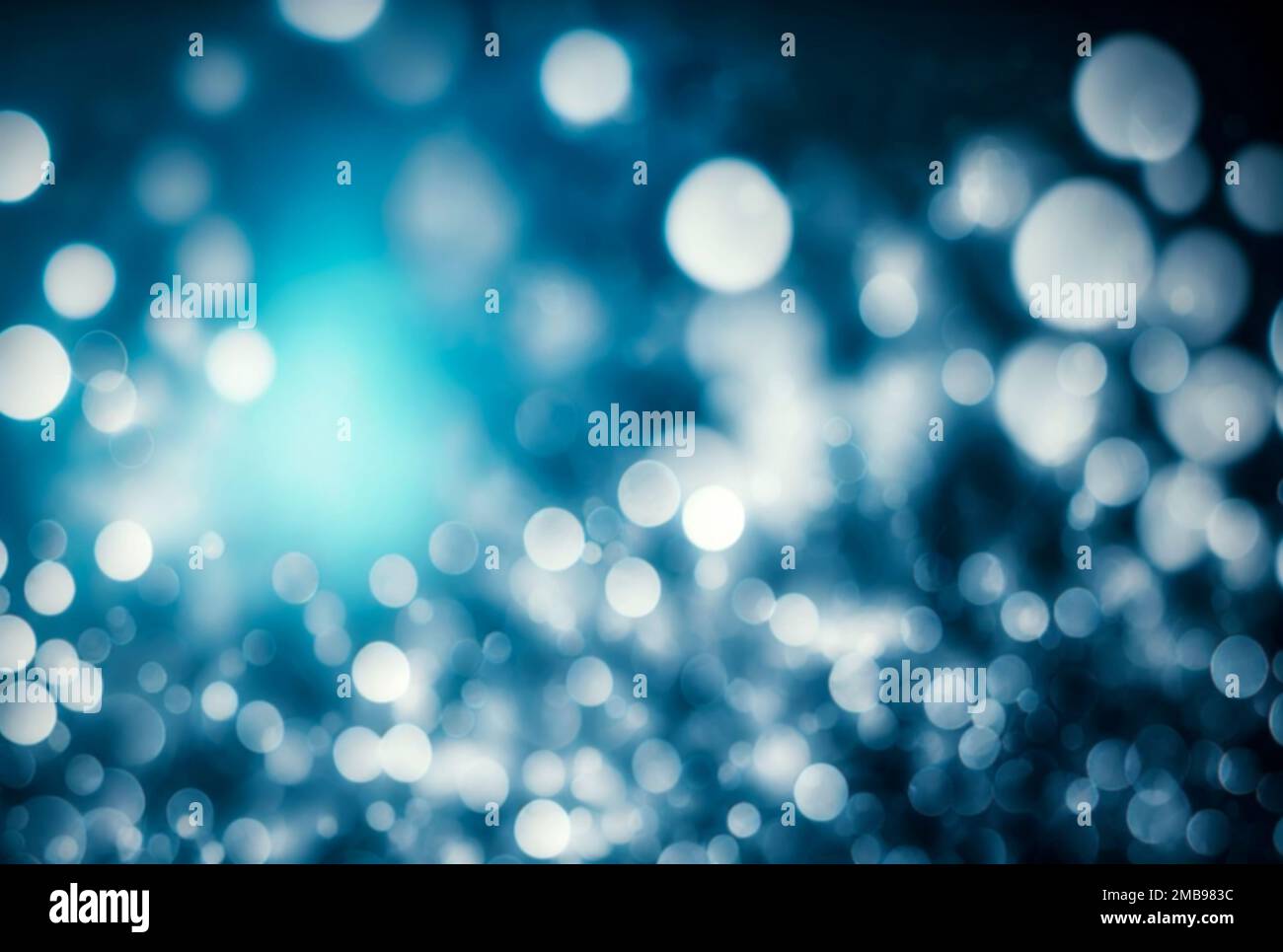 Arrière-plan bleu abstrait flou de bokeh avec différentes tailles de lumières brillantes rondes lumineuses et de taches sombres Banque D'Images