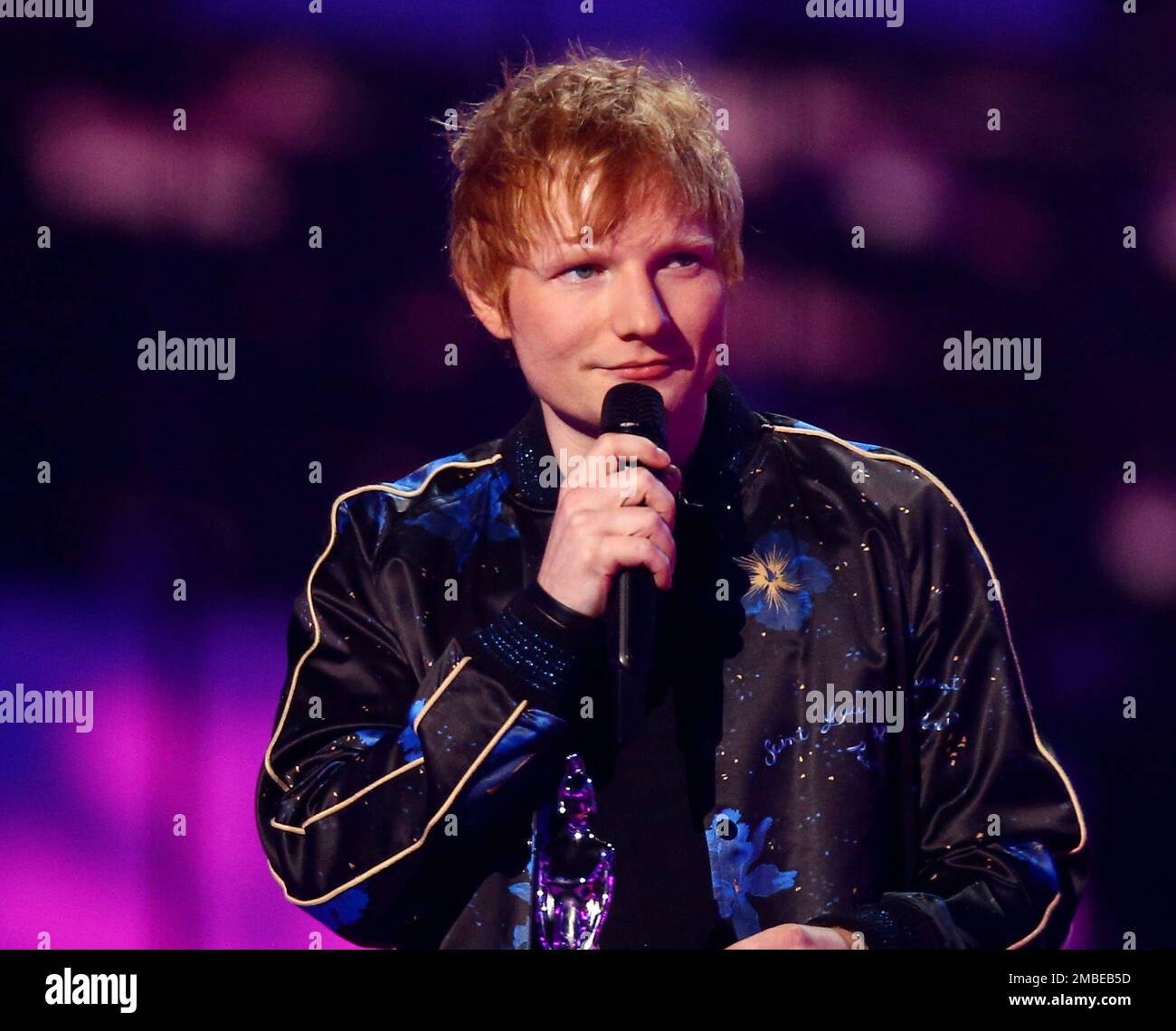 FILE - Singer Ed Sheeran appears on stage after winning songwriter of the  year at the Brit Awards 2022 in London on Feb. 8, 2022. Sheeran has  announced the birth of his