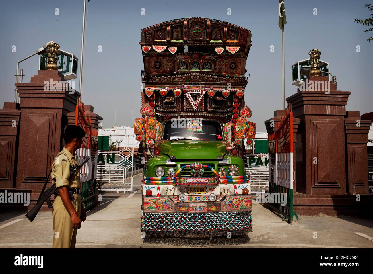 FILE - A truck enters into India from Pakistan through Wagah Border, India,  on June 13, 2011. Pakistan is allowing nuclear rival India to deliver tons  of wheat to Afghans struggling through