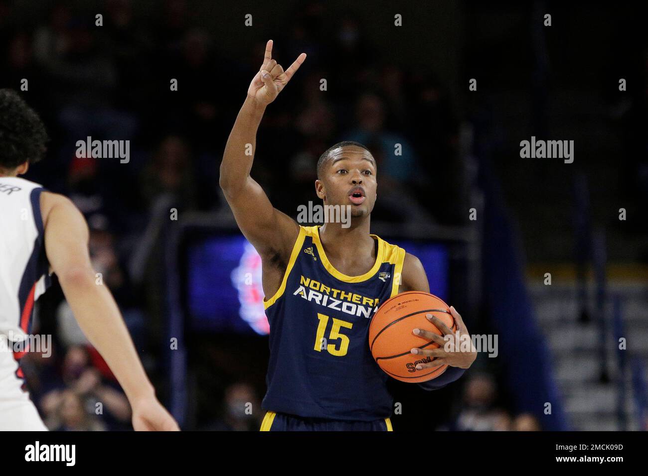 Northern Arizona guard Jalen Cone signals his teammates during the
