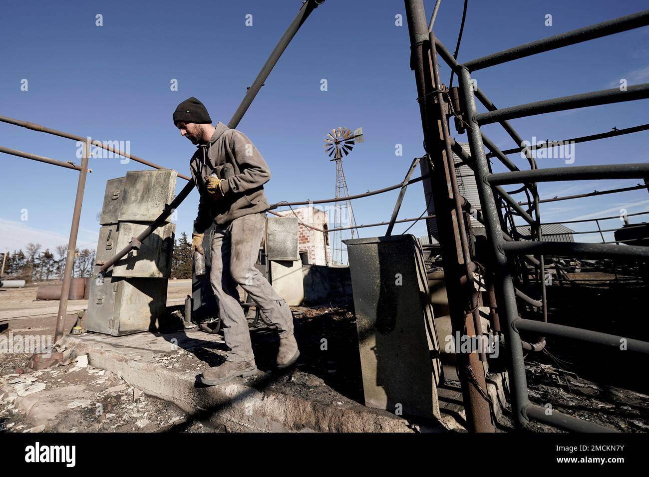 Destroyed Ranch Ranch hand Erik Vazquez clears debris from a barn after it was ...